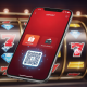Mobile phone displaying an online casino ShopeePay deposit interface with DuitNow QR and e-wallet balance options, set against a blurred background of spinning slot machine reels.