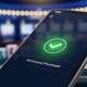 A smartphone screen showing a successful withdrawal confirmation from an online casino app, set against a luxurious, abstract background reinforcing security and speed.