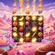 A vibrant 3D render of a candy-themed slot game, showing glossy fruit and candy symbols exploding mid-spin in a tumbling wins feature, set against a whimsical candy land background.